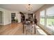 Bright dining room with wood floors, neutral walls and view of the kitchen and backyard at 801 Witmore Rd, Wingate, NC 28174