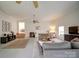 This living room features two rugs, seating and a view into another room at 801 Witmore Rd, Wingate, NC 28174