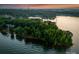 Overhead shot of lakefront property surrounded by lush trees and water, offering privacy and scenic views at 9184 Greenwood Rd, Terrell, NC 28682