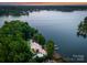 Picturesque home on Lake Norman with mature trees, private dock, stone seawall and lush landscaping at 9184 Greenwood Rd, Terrell, NC 28682