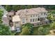 Stunning aerial view of home showcasing the tile roof, balconies, outdoor seating, and lush landscaping at 9184 Greenwood Rd, Terrell, NC 28682