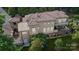 Stunning aerial view of home showcasing the tile roof, balconies, outdoor seating, and lush landscaping at 9184 Greenwood Rd, Terrell, NC 28682