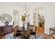 Formal dining room features hardwood floors and an elegant chandelier at 9184 Greenwood Rd, Terrell, NC 28682