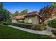 Mediterranean style home featuring manicured landscaping, stone pathway, and tile roof at 9184 Greenwood Rd, Terrell, NC 28682