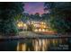 Waterfront property with a beautiful lawn and stone seawall on Lake Norman at 9184 Greenwood Rd, Terrell, NC 28682