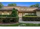 Charming home featuring a manicured lawn, stone walkway, and lush, trimmed hedges at 9184 Greenwood Rd, Terrell, NC 28682