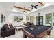 Spacious game room with coffered ceilings, pool table, and comfortable seating at 9184 Greenwood Rd, Terrell, NC 28682