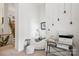 Cozy reading nook with a comfortable white beanbag chair and unique wall art near the open staircase at 9184 Greenwood Rd, Terrell, NC 28682