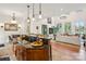 Spacious kitchen featuring a center island, breakfast bar, and open access to the living room at 9184 Greenwood Rd, Terrell, NC 28682