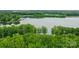 Beautiful lake view featuring tree coverage from an aerial perspective at 9184 Greenwood Rd, Terrell, NC 28682