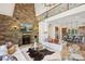 Grand living room boasts a stone fireplace, soaring ceilings, and open floor plan at 9184 Greenwood Rd, Terrell, NC 28682