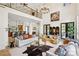 Bright living room with high ceilings, elegant chandelier, and comfortable seating arrangement at 9184 Greenwood Rd, Terrell, NC 28682