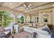 Expansive covered patio with a large comfortable sofa and lake views, perfect for relaxing and entertaining at 9184 Greenwood Rd, Terrell, NC 28682