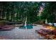 Lounge by the pool with stone patio and a covered patio overlooking the lake at 9184 Greenwood Rd, Terrell, NC 28682