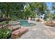 Inviting pool area featuring a spa, patio, lounge chairs, and lake views at 9184 Greenwood Rd, Terrell, NC 28682