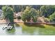 Stunning waterfront home with private dock and lush landscaping on a tree-lined lot at 9184 Greenwood Rd, Terrell, NC 28682
