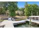 Beautiful lakefront property with boat dock, waterfront access and lush trees at 9184 Greenwood Rd, Terrell, NC 28682