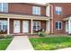 A charming brick townhome with covered front porch, neat landscaping, and inviting curb appeal at 102 Brandywine Ne Dr # O-3, Conover, NC 28613