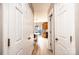 A bright hallway leads to an open dining area and kitchen, highlighting the home's layout at 102 Brandywine Ne Dr # O-3, Conover, NC 28613