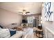 Living room with neutral walls, ceiling fan, modern decor, and convenient access to front door at 102 Brandywine Ne Dr # O-3, Conover, NC 28613