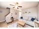 The living room showcases neutral tones, a ceiling fan, modern furniture, and an adjacent staircase at 102 Brandywine Ne Dr # O-3, Conover, NC 28613