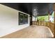 Inviting front porch with wooden railing, offering a cozy outdoor seating area at 103 Fleetwood Rd, York, SC 29745
