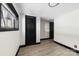 An empty room featuring sleek black doors, with clean walls and modern vinyl flooring at 103 Fleetwood Rd, York, SC 29745