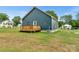 Blue house with a small deck in the backyard at 105 Churchill Dr, Kings Mountain, NC 28086