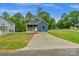 Charming blue house with a spacious front yard and concrete driveway at 105 Churchill Dr, Kings Mountain, NC 28086