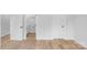 Bright hallway with wood floors leading to bathroom and bedroom doors at 105 Churchill Dr, Kings Mountain, NC 28086