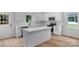 Contemporary kitchen with a quartz-topped island, stainless appliances, and ample counter space at 105 Churchill Dr, Kings Mountain, NC 28086