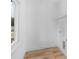 A bright laundry room with a window and wire shelving at 105 Churchill Dr, Kings Mountain, NC 28086