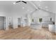 Open-concept living space with vaulted ceilings, hardwood floors, and white trim at 105 Churchill Dr, Kings Mountain, NC 28086