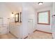 Bright bathroom features a double vanity, wood accents, and a window that brings in natural light, creating a fresh ambiance at 109 Larch Rd, Salisbury, NC 28147