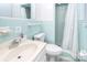 Classic bathroom with a tiled shower, commode, and vanity at 109 Larch Rd, Salisbury, NC 28147