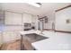 An updated kitchen features white cabinets, an island, and stainless steel appliances at 109 Larch Rd, Salisbury, NC 28147