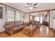 A spacious living room is brightly lit with natural light and features two leather sofas at 109 Larch Rd, Salisbury, NC 28147