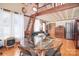 Cozy living room boasts wood floors, a charming loft, and stainless steel appliances, creating a welcoming ambiance at 109 Larch Rd, Salisbury, NC 28147