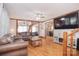 Cozy living room with hardwood floors, wood trim, and an open layout to additional rooms at 109 Larch Rd, Salisbury, NC 28147