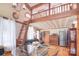Charming living room features a loft, wood floors, and stainless steel appliances, blending rustic charm with modern amenities at 109 Larch Rd, Salisbury, NC 28147