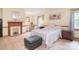 Serene bedroom features a decorative fireplace, plush carpeting, and ample natural light for a peaceful retreat at 109 Larch Rd, Salisbury, NC 28147