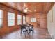 Game room featuring paneled walls, windows, and a ceiling fan at 109 Larch Rd, Salisbury, NC 28147