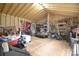The interior of a shed with exposed wood frame and rafters and assorted items at 109 Larch Rd, Salisbury, NC 28147