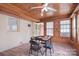 Bright sunroom with wood paneling, brick accent wall, and lots of natural light perfect for relaxing or entertaining at 109 Larch Rd, Salisbury, NC 28147