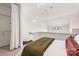 Lofted bedroom area with white walls, closet with shelving, and high ceiling at 115 E Park Ave # 409, Charlotte, NC 28203