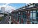 Beautiful brick building featuring multiple balconies, blending urban charm with city views along the train tracks at 115 E Park Ave # 409, Charlotte, NC 28203