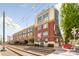 Attractive brick building with a blend of classic and modern architecture, featuring balconies and street-level access at 115 E Park Ave # 409, Charlotte, NC 28203
