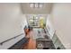 Bright open floor plan features modern kitchen, living area, high ceilings, and a staircase to a second level at 115 E Park Ave # 409, Charlotte, NC 28203