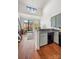 Stylish living space with a modern staircase, kitchen, and comfortable seating, creating a cozy and inviting atmosphere at 115 E Park Ave # 409, Charlotte, NC 28203