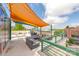 Stylish rooftop terrace with comfortable seating and colorful sunshade, perfect for outdoor entertaining at 115 E Park Ave # 409, Charlotte, NC 28203